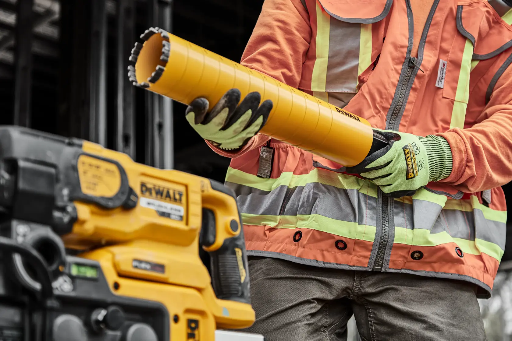 Image of a DEWALT branded yellow drill bit with depth control indicators marked from 1 inch to 10 inches along its length. The image labels key features: compatibility with power tools using standard drilling patterns, laser-welded diamond turbo and crown segments, and depth control indicators. Additional notes mention the use of diamonds made for drilling and specify adapter requirements for certain sizes.