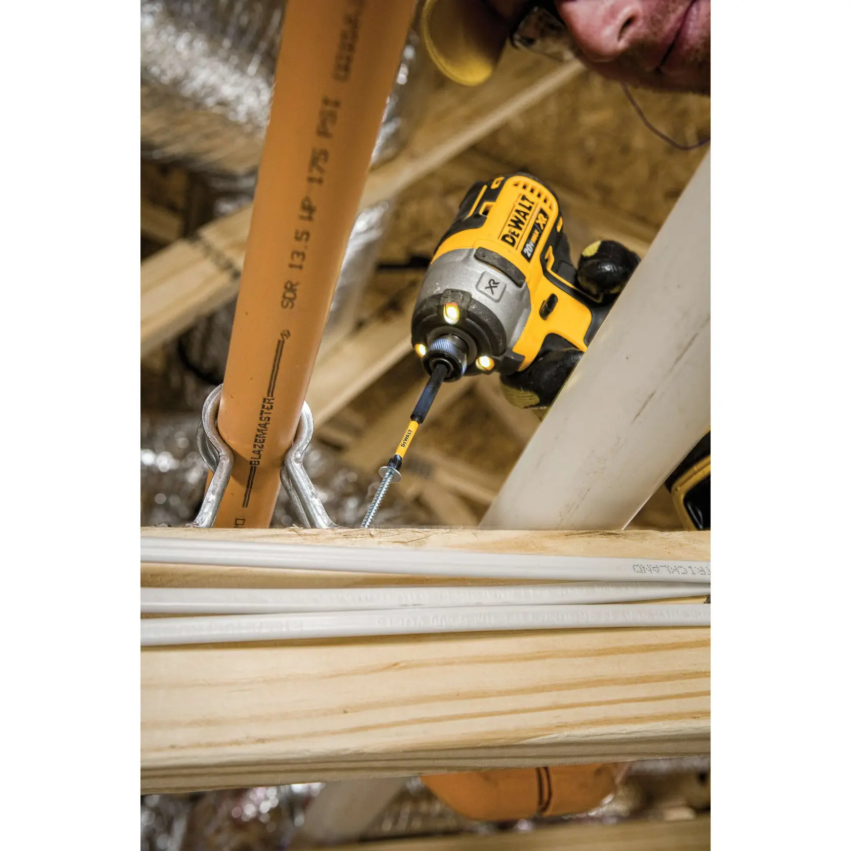 3 and half inch Phillips number 1 impact ready flextorq drill bits 50 units being used by a person to drill bit.rn