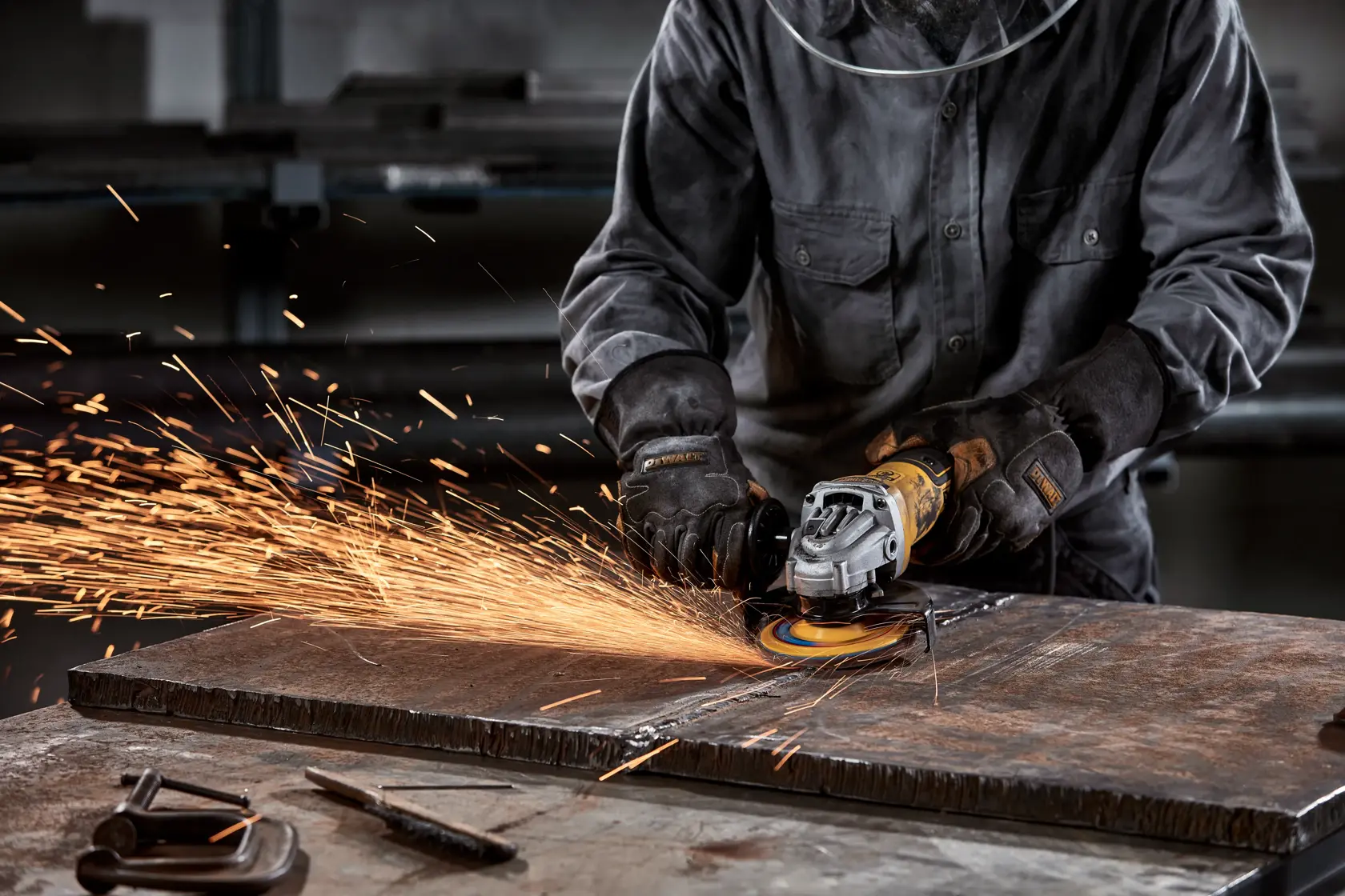 A DEWALT Elite Series abrasive flap disc with a yellow center and brown abrasive edge. It is marked with specifications including 4-1/2 inch (115 mm) diameter and 5/8-11 inch (16 mm) arbor. The disc is labeled for metal use and displays safety icons and instructions on the front.