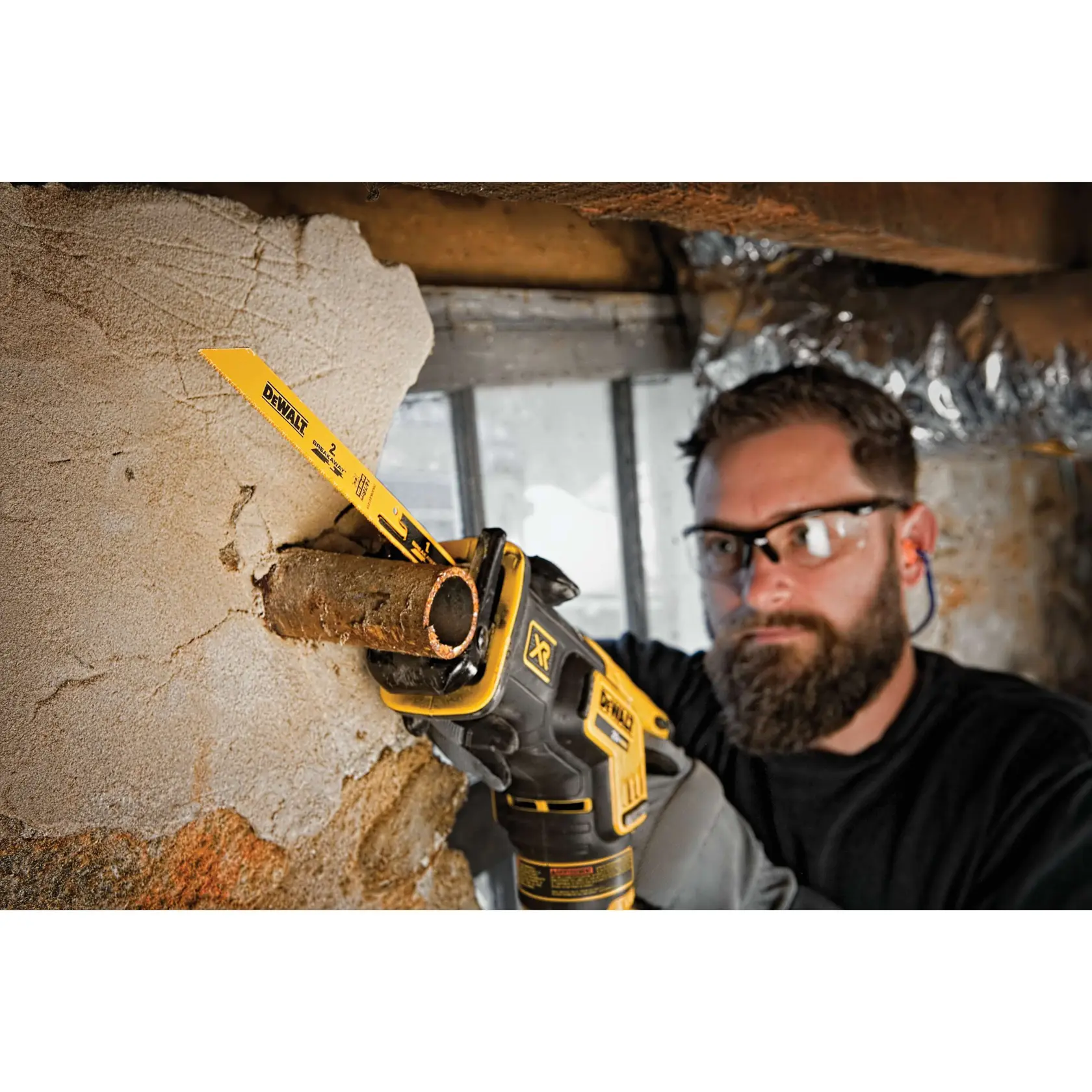 BREAKAWAY reciprocating saw blade being used by a person.