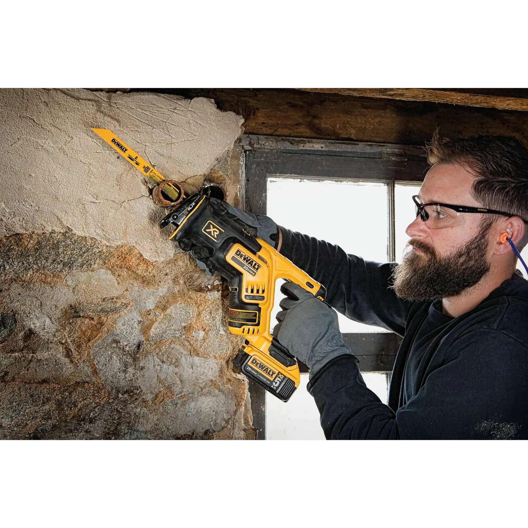 Side view of BREAKAWAY reciprocating saw blade being used by a person.