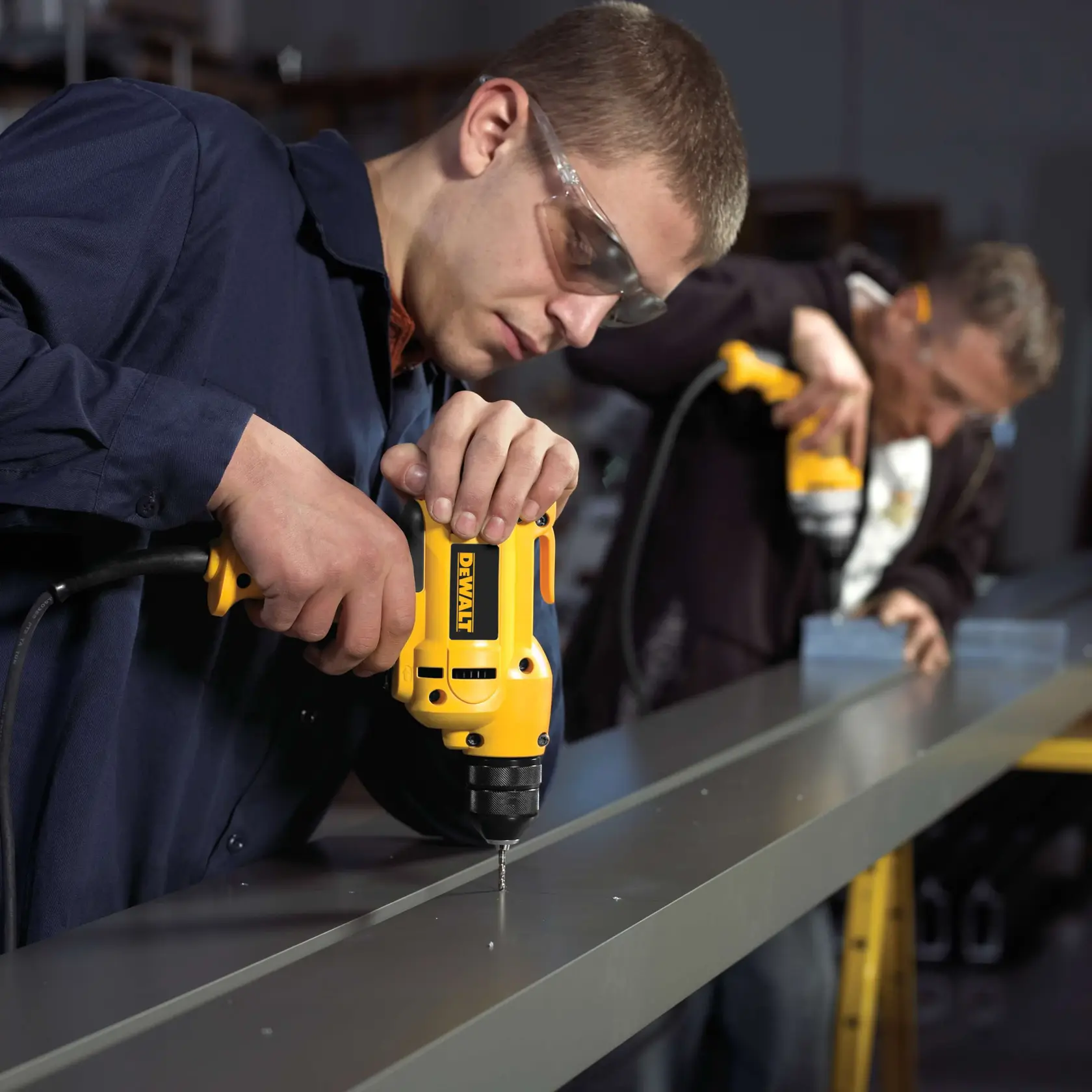 A DEWALT electric drill is shown, featuring a yellow and black body with a 3/8 inch ratcheting keyless chuck. The drill is labeled as offering up to 2,500 RPM and is lightweight at only 4.1 pounds.