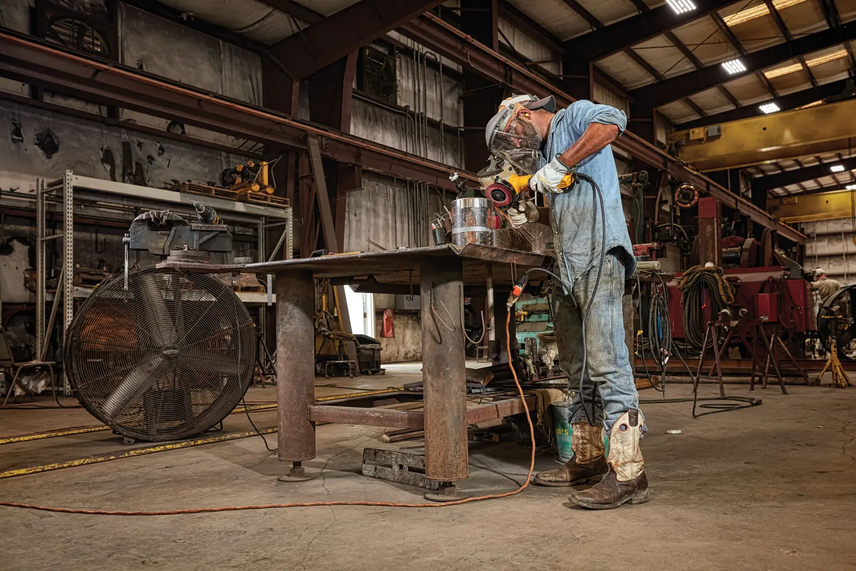 Image of a DEWALT DWE43214N 5-inch brushless paddle switch small angle grinder, shown with its accessories including a 6-inch Type 27 guard, side handle, hex key, and inner and outer flange. The tool is yellow and black in color and the packaging text lists included components.