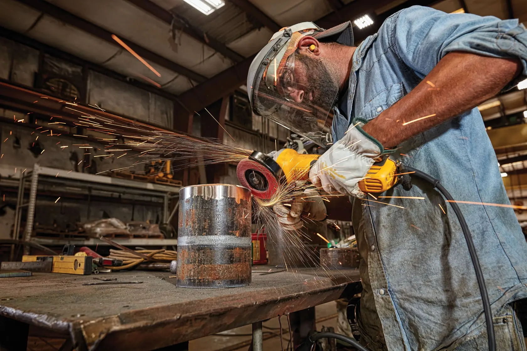 Image of a DEWALT DWE43214N angle grinder featuring a yellow and black body. Notable details include: brushless motor, Perform Protect and E-Clutch labels, a side handle, and specifications pointing to weight (5.3 lbs), length (13.6 inches), and a 13 amp motor.