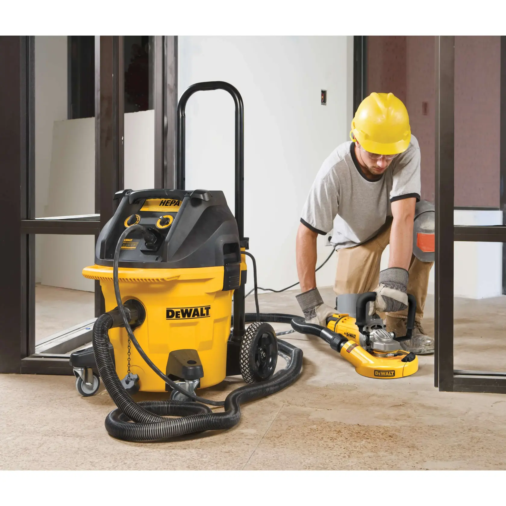 A yellow DEWALT 7-inch angle grinder with black accents, featuring labeled parts: steel-cut gears and a low-profile gearcase.