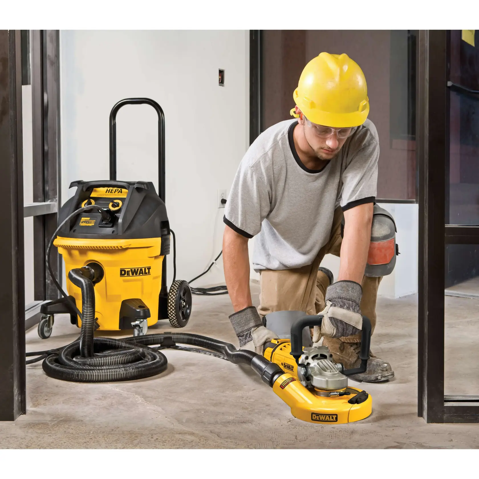 A yellow and black DEWALT angle grinder with a side handle, shown against a white background. Below, the text reads: 'Added durability with dust ejection system.'