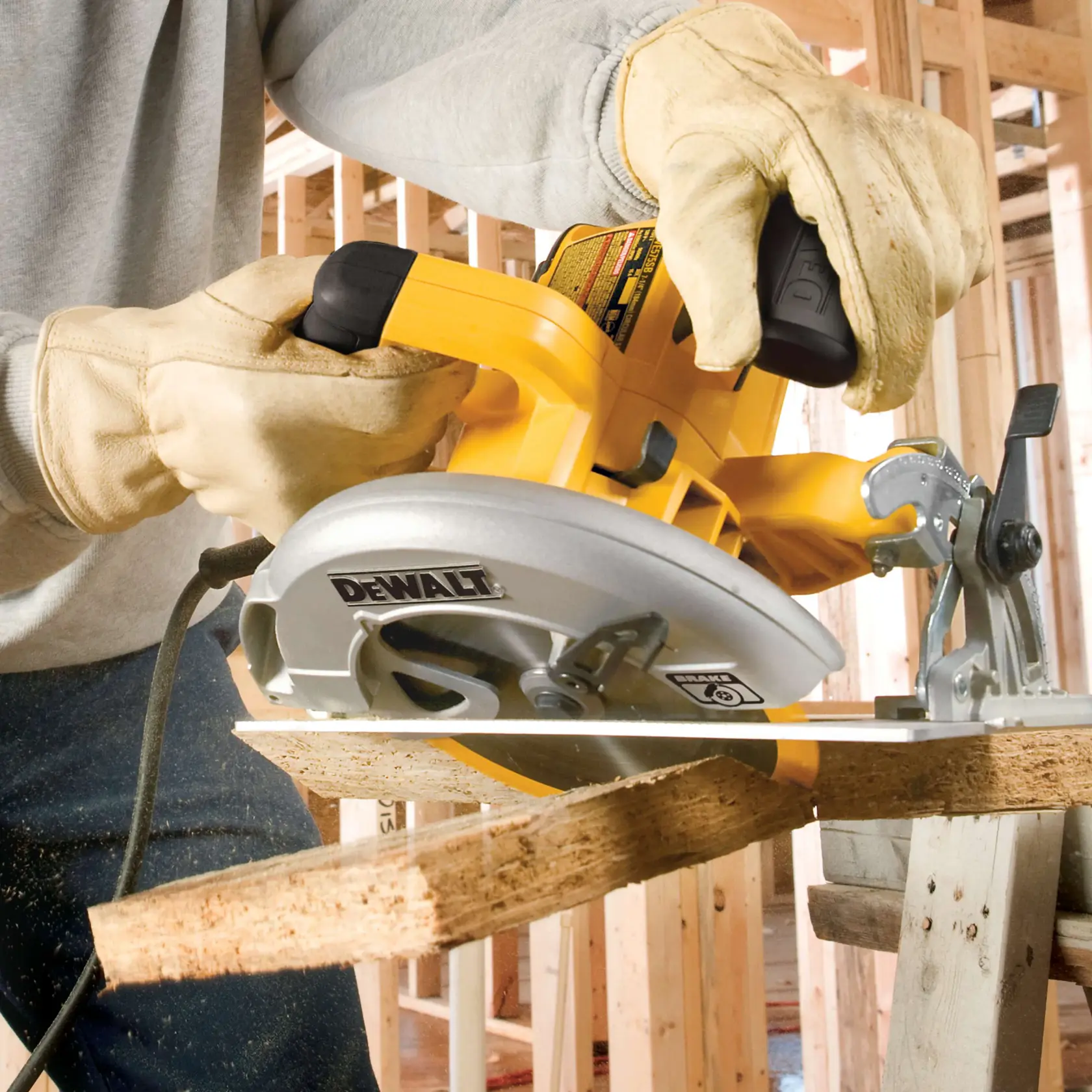 A DEWALT DWE575SB circular saw being used to cut wood, featuring a 15 amp motor for power in tough applications. The saw is held by a person and is shown actively cutting through a piece of plywood with text highlighting its motor strength.