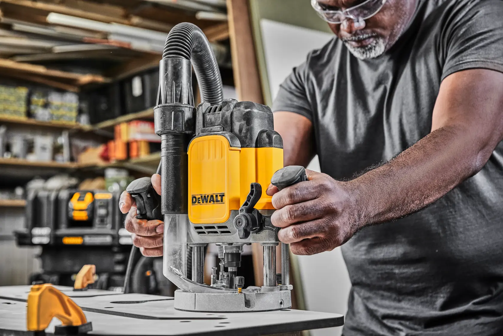 DEWALT router DWE625-QS, DWE625 in use in workshop, shown in photography product category.
