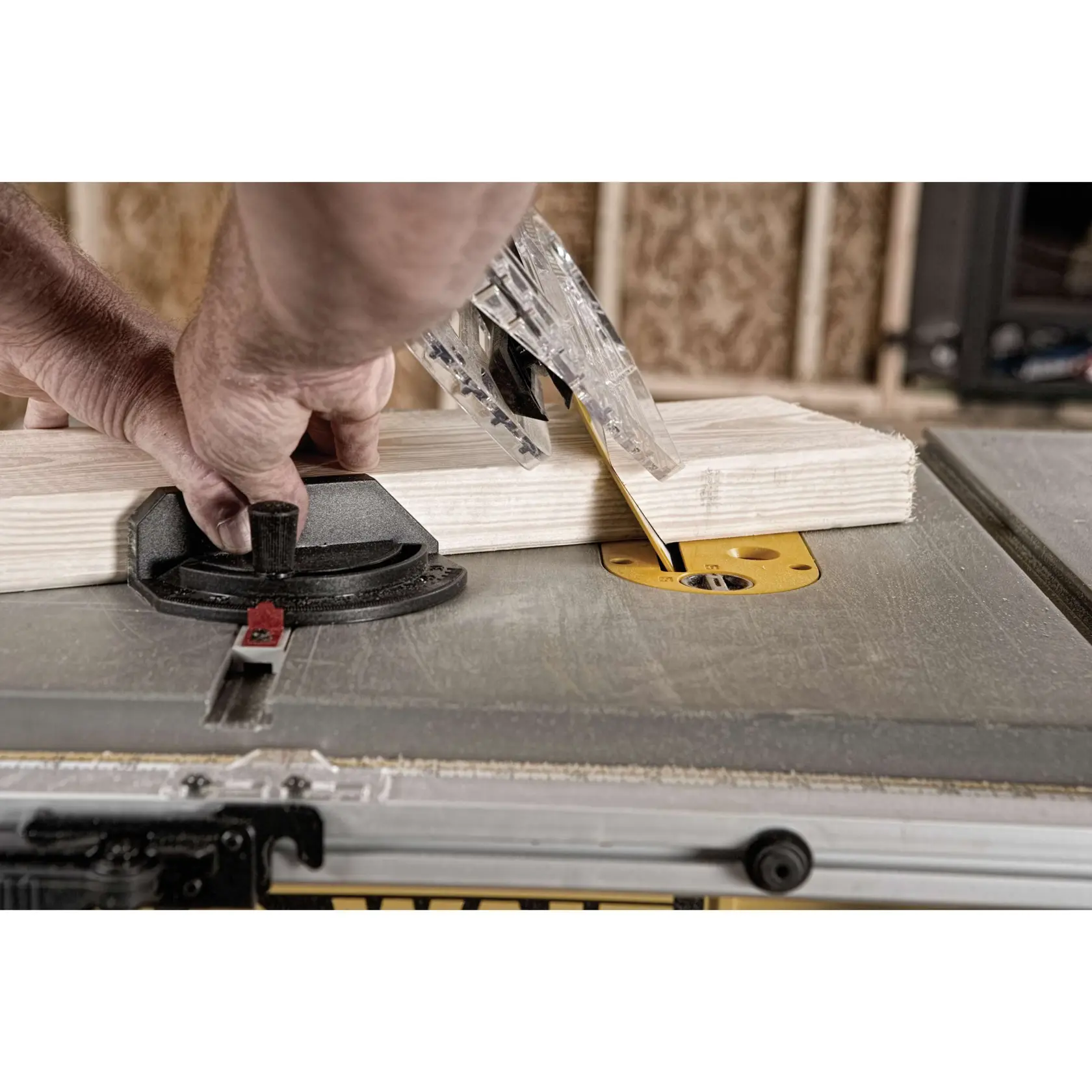 Close-up of DEWALT DWE7491RS onboard storage system for accessories and power cord.