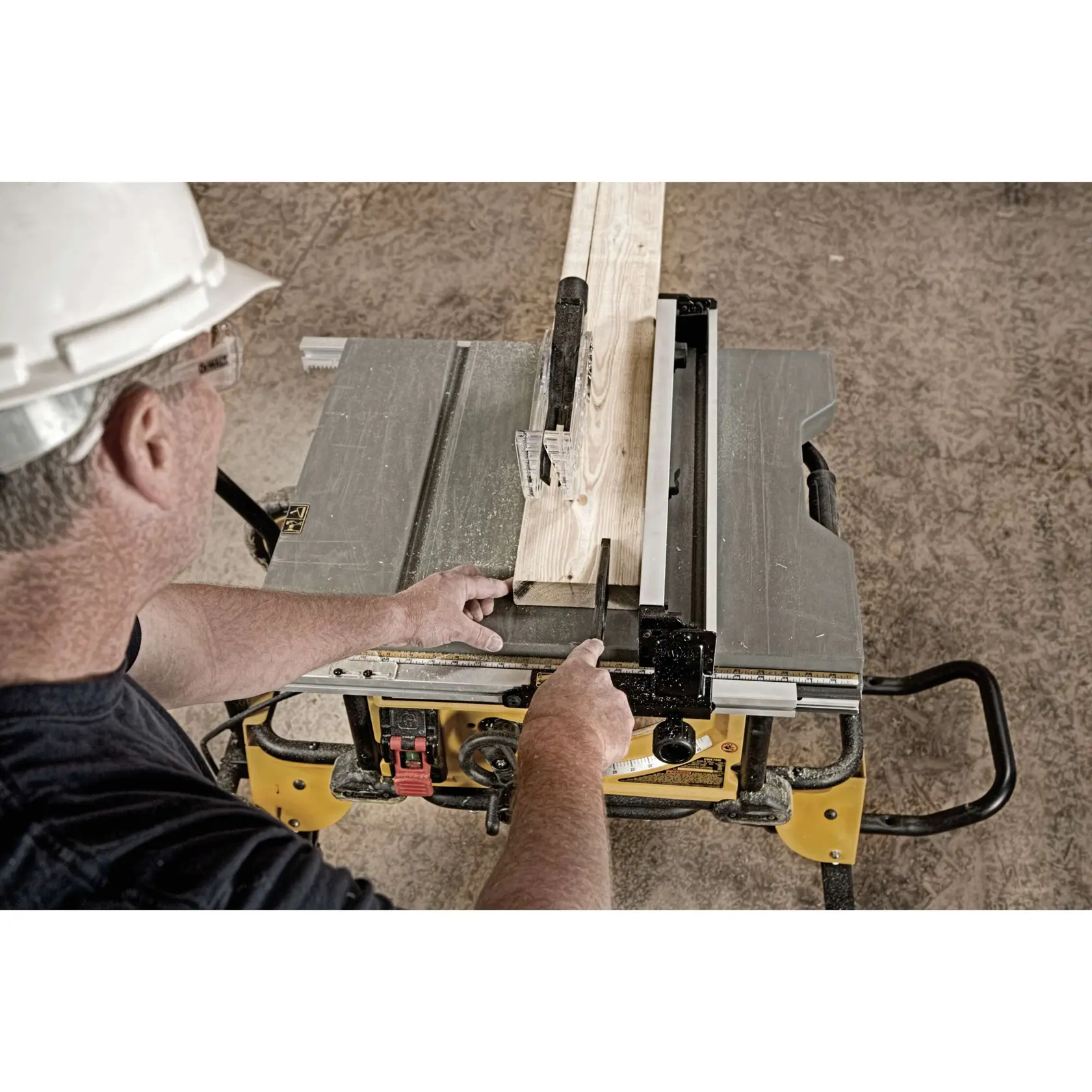 Close-up of a dust collection port releasing sawdust from a DEWALT tool. Text highlights 2-1/2 inch size.