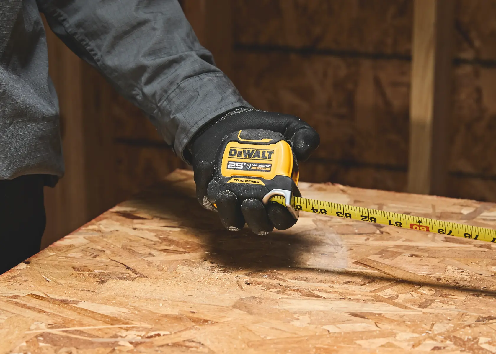 A DEWALT ToughSeries magnetic tape measure with a 25-foot length, model DWHT37925, featuring a yellow and black casing.