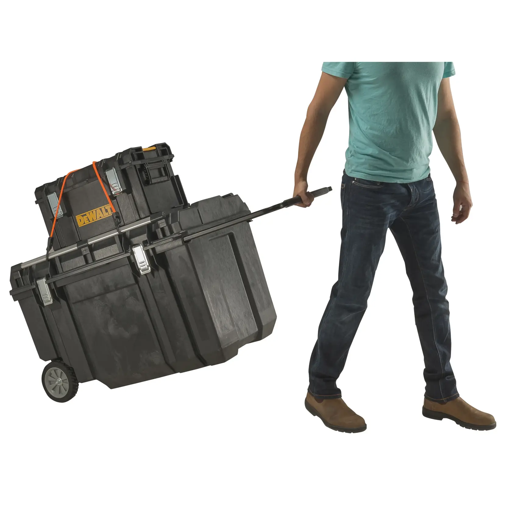 A person is pulling a large wheeled DEWALT tool storage box with an attached smaller box, using a long handle. The tool boxes are black with metal latches, and the DEWALT logo is visible.