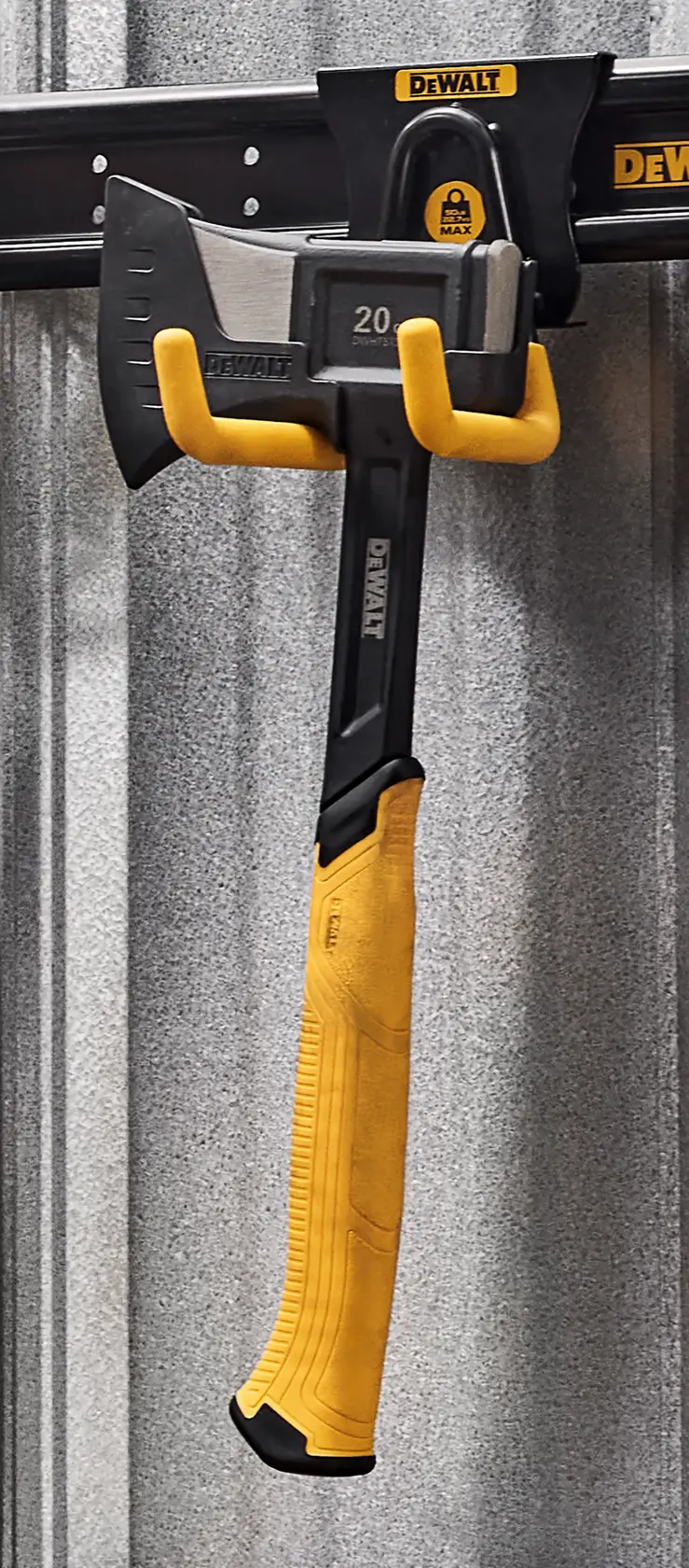 A DEWALT axe with a yellow handle is hanging on a DEWALT branded wall rack in a workshop. The rack is mounted on a metal wall.