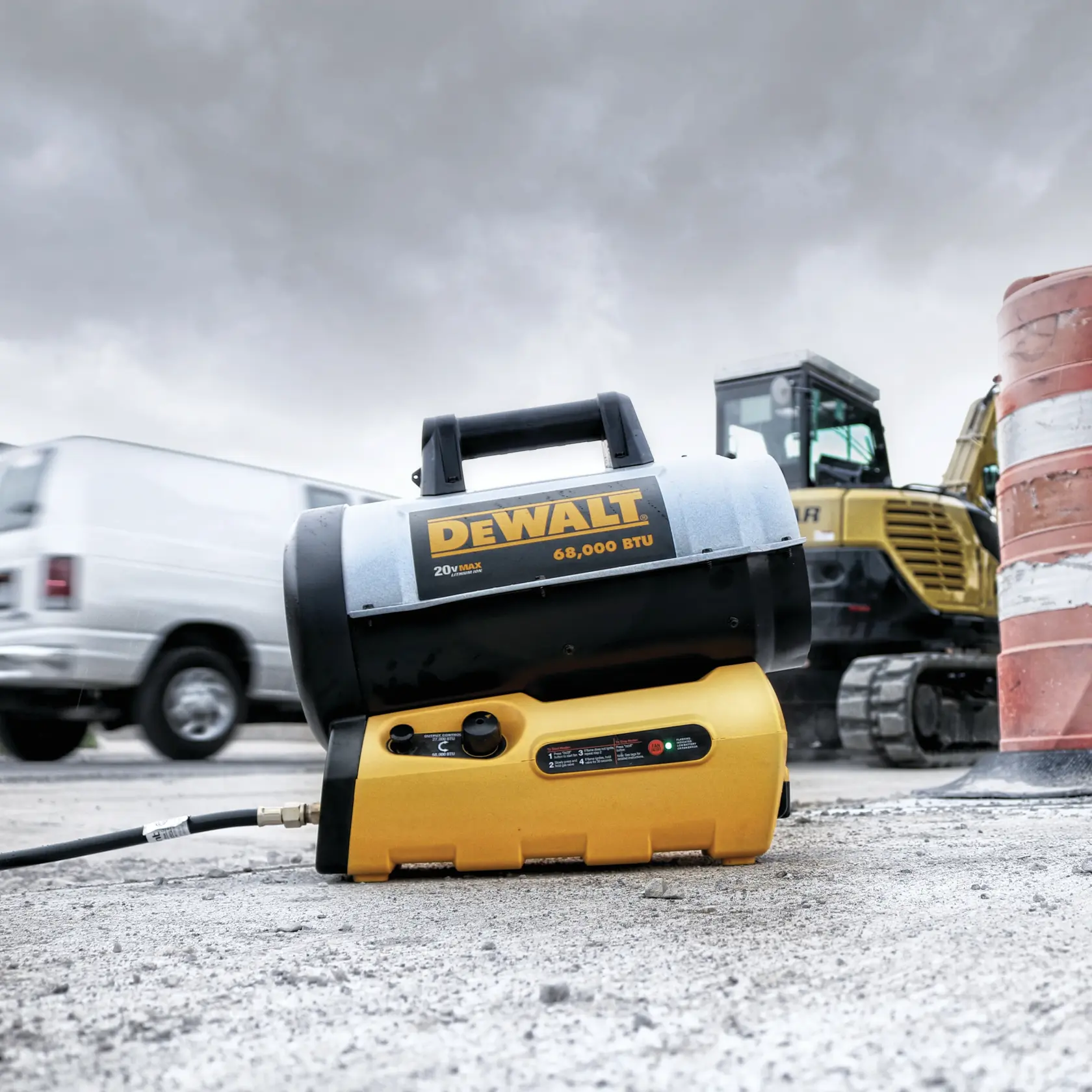 A DEWALT propane forced air heater, model DXH70CFAV, with 68,000 BTU capacity, is placed on an outdoor construction site. The background includes a white van, a yellow excavator, and an orange-striped construction barrier.