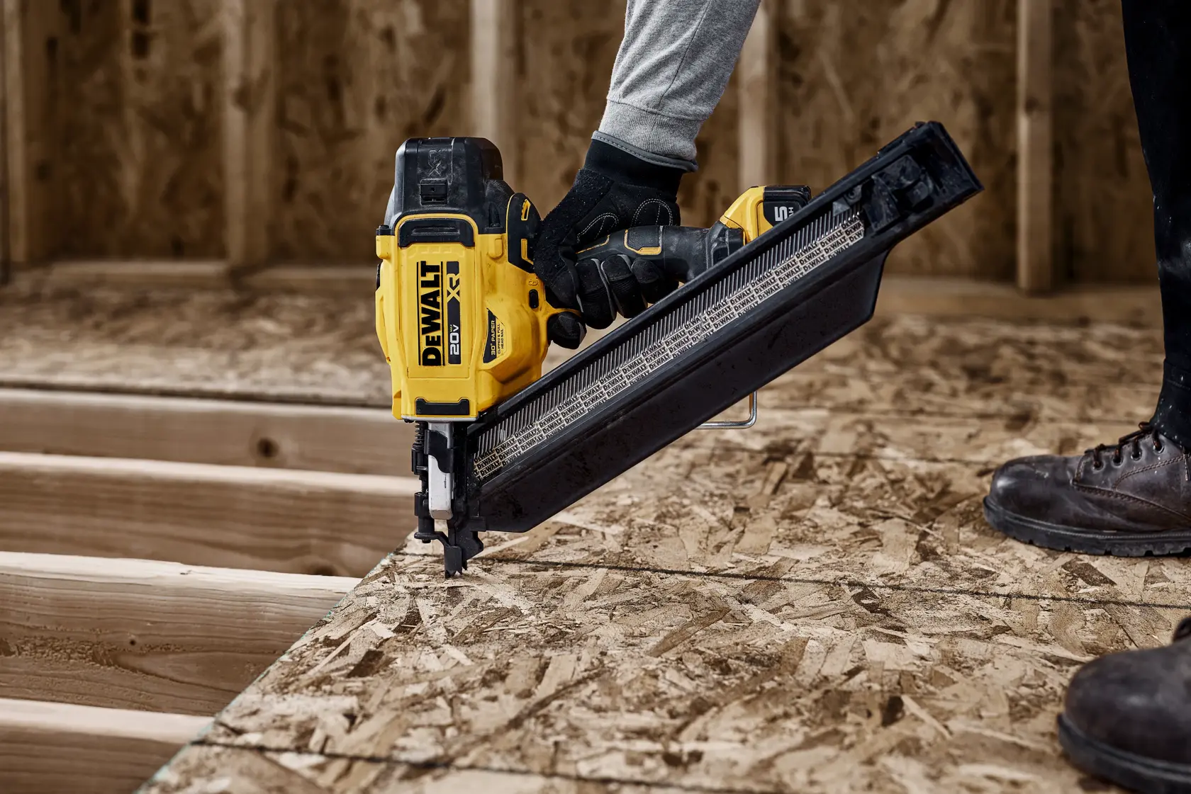 DEWALT nailer in use on wood, model DZN930-XJ, DZN930. Photography product. Construction scene.